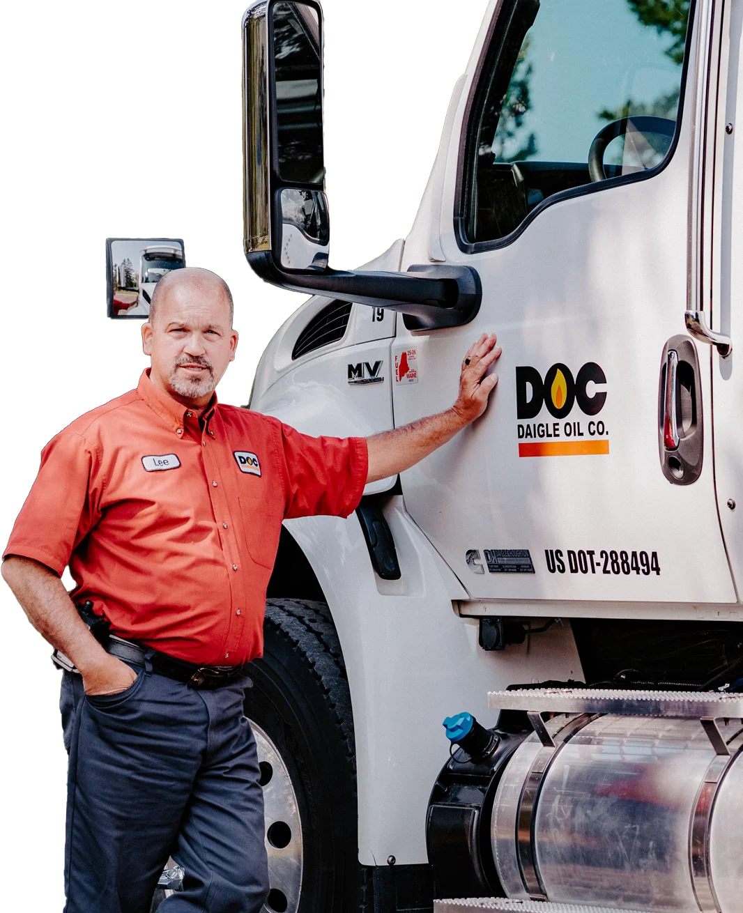 daigle working in his work uniform leaning against a fuel delivery truck