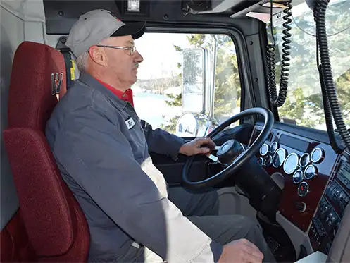 daigle delivery driver at the wheel of his work truck