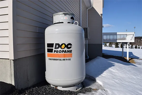 propane tank next to a suburban house with the DOC logo on it