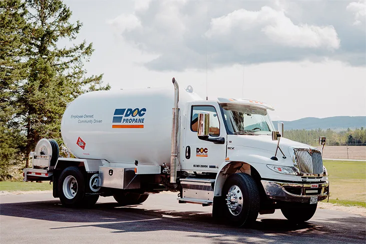 Daigle oil propane truck parked on a new Hampshire back road on a a sunny day