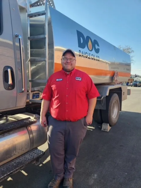 daigle employee standing by a large truck