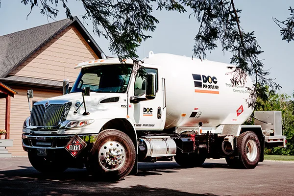 daigle fuel truck sitting in the driveway of a house