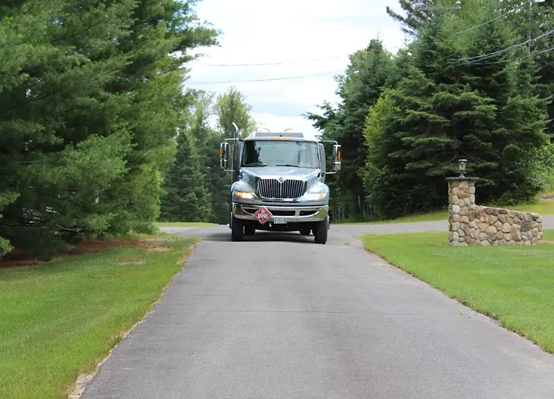 truck driving into a residential driveway