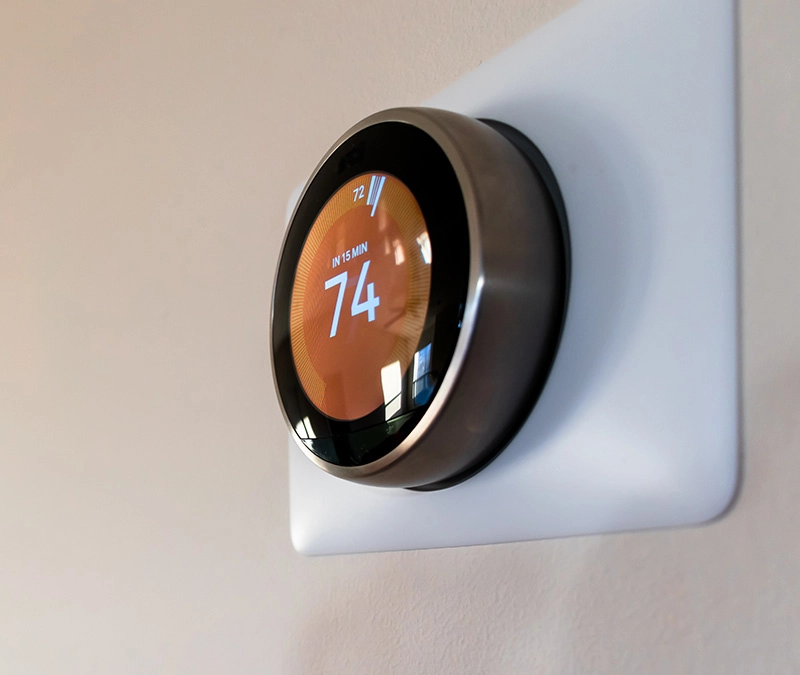 smart thermostat showing that the heat is on